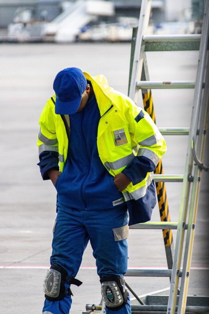 vehicle, man, safety, blue-collar worker, clothing, high-visibility clothing, person, people, construction worker, helmet, financial security, workwear, hardhat, industry, personal protective equipment, coat, gloves, outerwear, pants, adult, worker, machinery, face, outdoors, construction, workwear, workwear, workwear, workwear, workwear